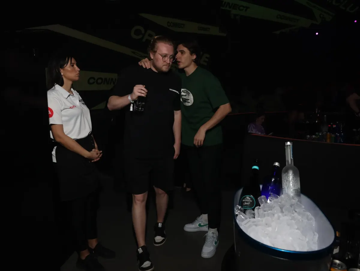 Guests talking at an event venue with drinks and an ice cooler, suited to real estate and developer events in Dubai Guests talking at an event venue with drinks and an ice cooler, suited to real estate and developer events in Dubai